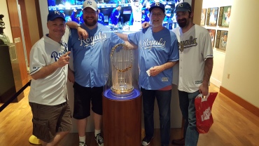 From left: Mike, Tom, me and Joe with the Royals' 2015 World Series trophy.